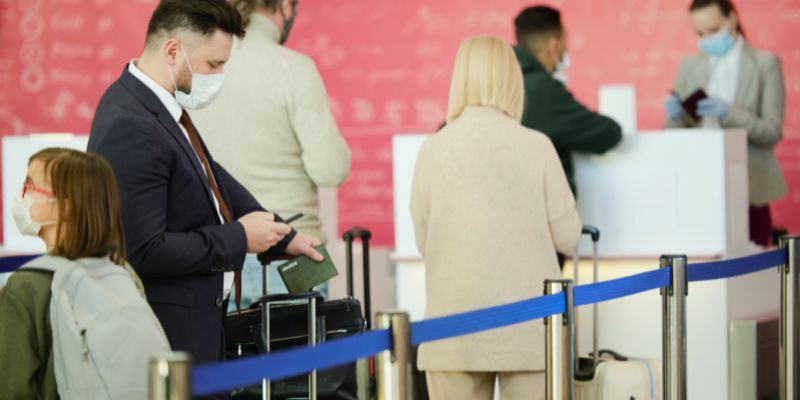 people are waiting in queue for the boarding at airport